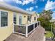 Balcony view with grill, furniture, and tiki hut roof, offering relaxation and outdoor living space at 4116 Diaz Ct, Hernando Beach, FL 34607
