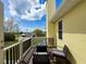 A cozy balcony featuring stylish furniture and a fire pit table, perfect for outdoor enjoyment and watching the clouds at 4116 Diaz Ct, Hernando Beach, FL 34607