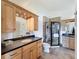 Bright bathroom features a vanity with cabinets, granite counters, and walk-in shower at 4116 Diaz Ct, Hernando Beach, FL 34607
