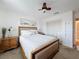 Bright bedroom features a ceiling fan, closet, and a serene painting above the bed at 4116 Diaz Ct, Hernando Beach, FL 34607