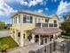 Stilt home with a tiki bar underneath and an upper balcony, perfect for outdoor entertaining with water views at 4116 Diaz Ct, Hernando Beach, FL 34607