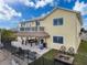 Home exterior with an entertainment space including outdoor kitchen, a patio, and a fire pit at 4116 Diaz Ct, Hernando Beach, FL 34607