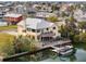 Beautiful waterfront home boasting a tiki bar, fire pit, and private dock, perfect for entertaining and relaxation at 4116 Diaz Ct, Hernando Beach, FL 34607