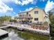 Charming waterfront property featuring a tiki bar, fire pit, and private dock for enjoying the canal life at 4116 Diaz Ct, Hernando Beach, FL 34607