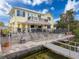 A waterfront property showcases a backyard tiki bar, outdoor seating, and private boat dock at 4116 Diaz Ct, Hernando Beach, FL 34607