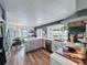Open concept kitchen with stainless appliances, stone countertops, eat in dining area and water view at 4116 Diaz Ct, Hernando Beach, FL 34607