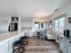 Eat-in kitchen with breakfast bar, stainless steel appliances, dining area, and wood floors at 4116 Diaz Ct, Hernando Beach, FL 34607