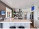 Updated kitchen with modern appliances, island with seating, and television at 4116 Diaz Ct, Hernando Beach, FL 34607