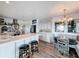Bright kitchen with island seating, stainless steel appliances, and adjacent dining area at 4116 Diaz Ct, Hernando Beach, FL 34607