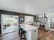 Spacious kitchen featuring an island with stool seating, modern appliances, and open floor plan at 4116 Diaz Ct, Hernando Beach, FL 34607