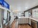 Bright, updated kitchen with stainless steel appliances, stone countertops and luxury vinyl flooring at 4116 Diaz Ct, Hernando Beach, FL 34607