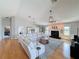 Bright and airy living room featuring hardwood floors, a fireplace, and a stylish seating arrangement at 4116 Diaz Ct, Hernando Beach, FL 34607