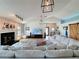 Open-concept living room with vaulted ceilings, fireplace, and natural light at 4116 Diaz Ct, Hernando Beach, FL 34607