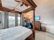 Main bedroom features a four-poster bed, television, and a sitting area at 4116 Diaz Ct, Hernando Beach, FL 34607