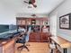 Office space featuring beautiful wood floors, custom built-in shelving, and a large desk at 4116 Diaz Ct, Hernando Beach, FL 34607
