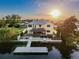 Aerial view of a waterfront home featuring an outdoor patio with a tiki bar and new boat dock at 4116 Diaz Ct, Hernando Beach, FL 34607