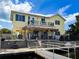 Waterfront home featuring a tiki bar, patio, and balcony, offering outdoor relaxation and boat access at 4116 Diaz Ct, Hernando Beach, FL 34607