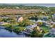 A waterfront home with a backyard patio, dock and beautiful landscaping at 4116 Diaz Ct, Hernando Beach, FL 34607