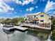 Waterfront home with boat dock, patio, and tiki bar, perfect for outdoor entertaining and relaxation at 4116 Diaz Ct, Hernando Beach, FL 34607