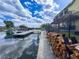 Property featuring a dock, tiki bar, and waterfront access on a canal at 4116 Diaz Ct, Hernando Beach, FL 34607