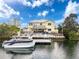 Waterfront home boasts a private dock and tiki bar, ideal for boating, entertaining, and waterfront living at 4116 Diaz Ct, Hernando Beach, FL 34607