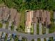 Aerial view of home, showcasing the neighborhood's layout and roof lines at 456 Lakeview Dr # 5, Palm Harbor, FL 34683
