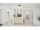 Home bar area featuring mirrored shelving and storage cabinets at 456 Lakeview Dr # 5, Palm Harbor, FL 34683