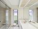 Bright bathroom features double sinks, large mirror, and walk-in shower at 456 Lakeview Dr # 5, Palm Harbor, FL 34683