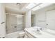 Bathroom featuring a shower-tub combo with glass doors, and a vanity with sink at 456 Lakeview Dr # 5, Palm Harbor, FL 34683