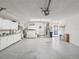 Spacious garage featuring laundry area, storage cabinets, utility sink, and access to the home at 456 Lakeview Dr # 5, Palm Harbor, FL 34683