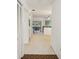 Hallway view leading to the living area, complemented by ample closet space at 456 Lakeview Dr # 5, Palm Harbor, FL 34683