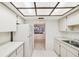 Bright kitchen showcasing white appliances and view into the living area at 456 Lakeview Dr # 5, Palm Harbor, FL 34683