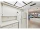 Bright kitchen with white cabinets, adjoining the living space at 456 Lakeview Dr # 5, Palm Harbor, FL 34683
