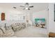 Spacious living room with neutral carpet, ceiling fan, and open floor plan with staircase at 456 Lakeview Dr # 5, Palm Harbor, FL 34683