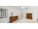 Spacious main bedroom features two dressers and neutral carpet at 456 Lakeview Dr # 5, Palm Harbor, FL 34683