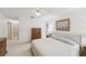 Main bedroom with neutral carpet and adjacent access to the main bathroom and closet at 456 Lakeview Dr # 5, Palm Harbor, FL 34683
