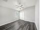 Bedroom with ceiling fan, closet, and luxury vinyl plank flooring at 5189 Brackenwood Dr, Spring Hill, FL 34609