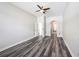Spacious bedroom with luxury vinyl plank flooring and ensuite bathroom access at 5189 Brackenwood Dr, Spring Hill, FL 34609