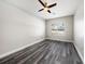 Bright bedroom with a ceiling fan, and luxury vinyl plank flooring at 5189 Brackenwood Dr, Spring Hill, FL 34609