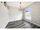Dining Room with modern chandelier and luxury vinyl plank flooring at 5189 Brackenwood Dr, Spring Hill, FL 34609