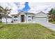 Charming single-story home with a well-manicured lawn and inviting curb appeal at 5189 Brackenwood Dr, Spring Hill, FL 34609