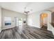 Spacious living room featuring stylish gray flooring, neutral walls, and a view of the pool at 5189 Brackenwood Dr, Spring Hill, FL 34609