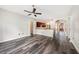 Open-concept living space with gray floors, dining area and open view of the front door at 5189 Brackenwood Dr, Spring Hill, FL 34609