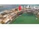 An aerial view showing the condo building, docks, and the surrounding waterfront at 530 S Gulfview Blvd # 303, Clearwater, FL 33767