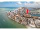 Aerial view of condo building near the beach with a red arrow over the building of interest at 530 S Gulfview Blvd # 303, Clearwater, FL 33767