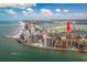 Aerial view showcases the building's location along the beach with close proximity to shopping and dining at 530 S Gulfview Blvd # 303, Clearwater, FL 33767