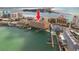 Aerial view of waterfront condo building with boat docks on a clear sunny day at 530 S Gulfview Blvd # 303, Clearwater, FL 33767