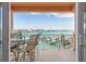 Relax on the balcony with stunning water views and enjoy the outdoor seating arrangement overlooking the marina at 530 S Gulfview Blvd # 303, Clearwater, FL 33767