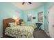 Bright bedroom with matching twin beds, leafy patterns, and a window at 530 S Gulfview Blvd # 303, Clearwater, FL 33767