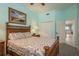 Comfortable bedroom with queen bed, ensuite bathroom, and plenty of natural light at 530 S Gulfview Blvd # 303, Clearwater, FL 33767